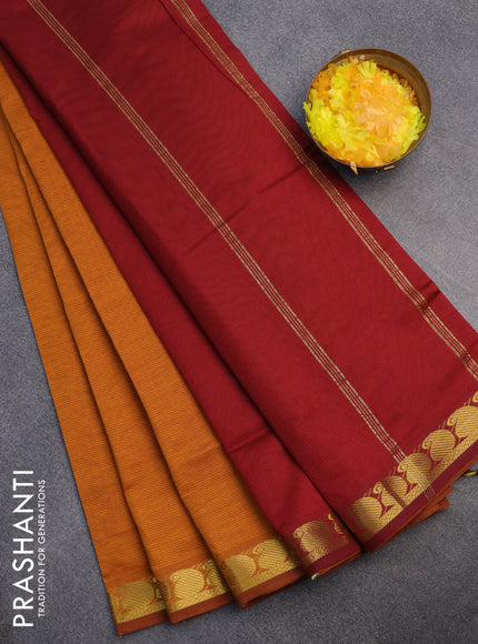 10 Yards poly cotton saree dark mustard and maroon with plain body and paisley zari woven border