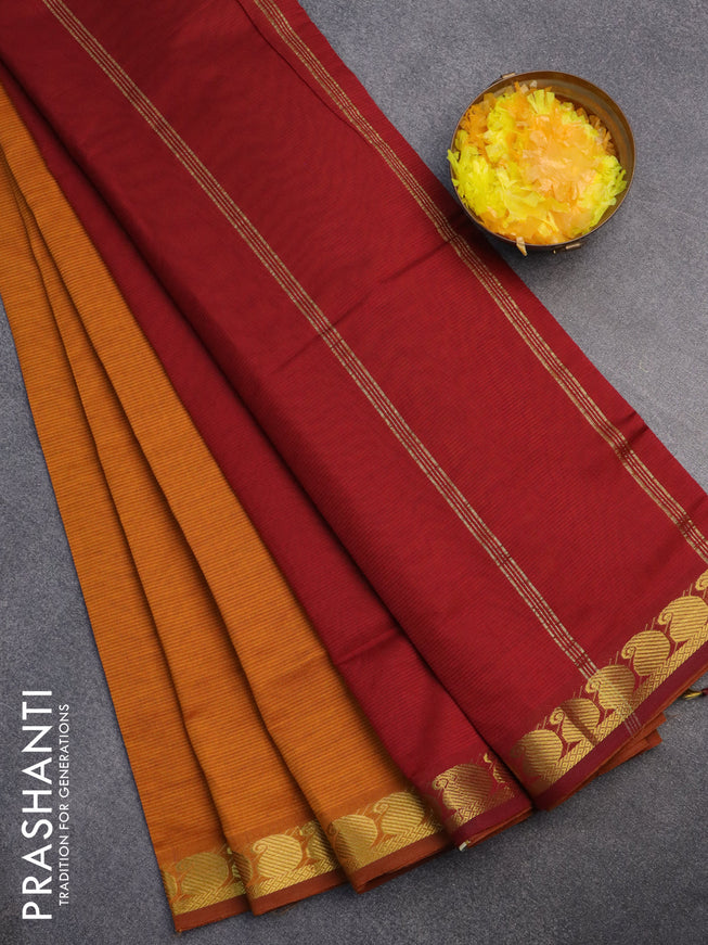 10 Yards poly cotton saree dark mustard and maroon with plain body and paisley zari woven border