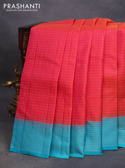 Pure soft silk saree dual shade of pinkish orange and teal blue with allover zari checked pattern and zari woven border