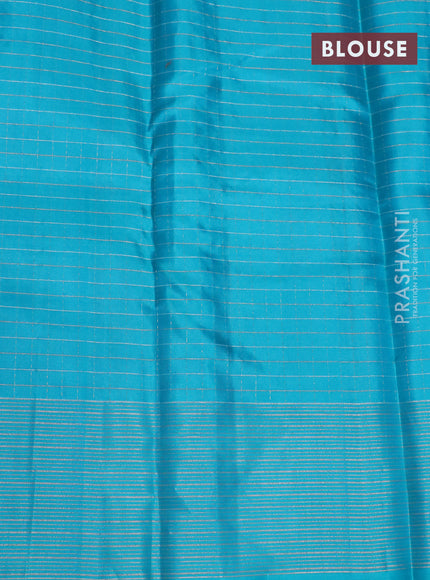 Pure soft silk saree dual shade of pinkish orange and teal blue with allover zari checked pattern and zari woven border