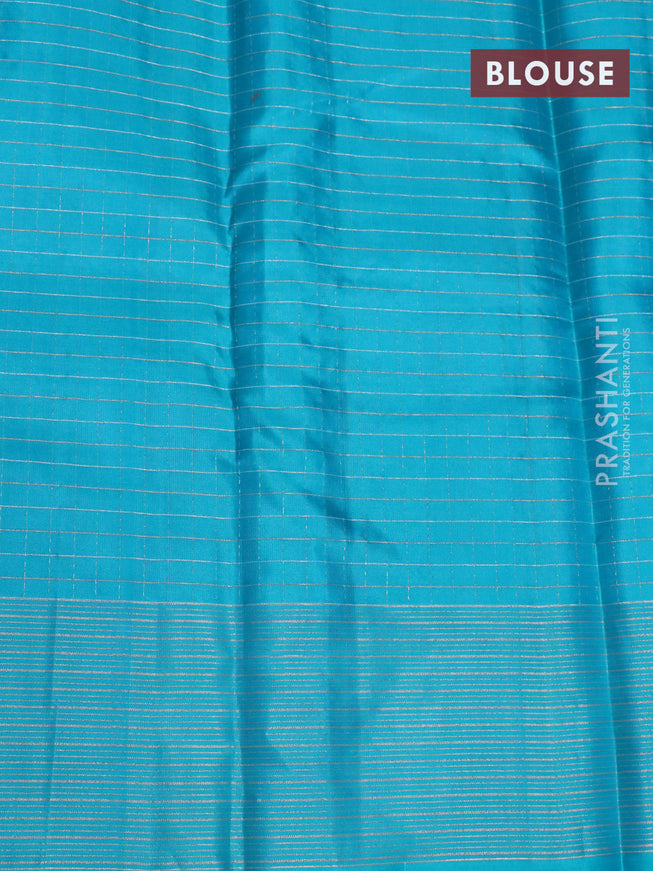 Pure soft silk saree dual shade of pinkish orange and teal blue with allover zari checked pattern and zari woven border