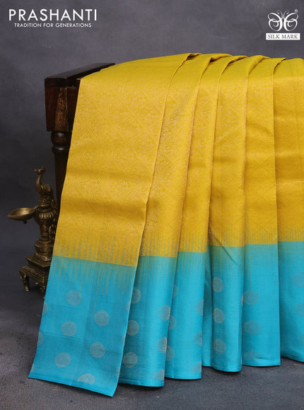 Pure soft silk saree yellow and teal blue with allover silver zari woven brocade weaves and silver zari woven butta border