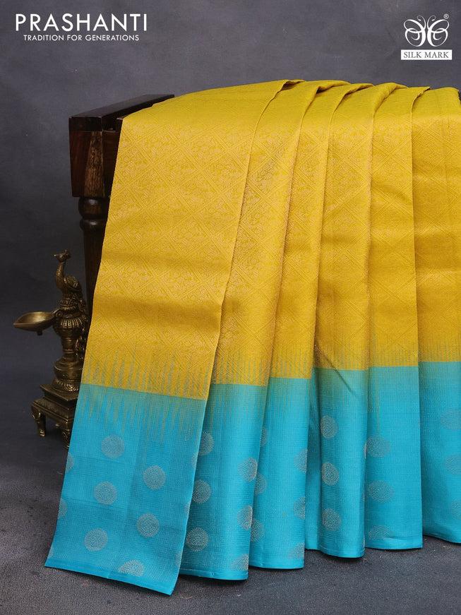 Pure soft silk saree yellow and teal blue with allover silver zari woven brocade weaves and silver zari woven butta border