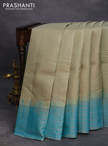 Pure soft silk saree elaichi green and teal blue with allover checked pattern & silver zari buttas and zari woven border