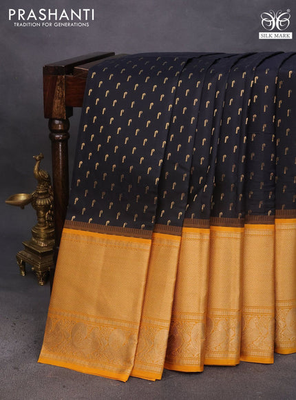 Pure soft silk saree black and mango yellow with allover zari woven buttas and long annam zari woven border