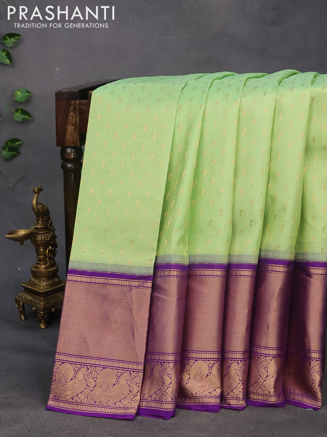 Pure soft silk saree pista green and violet with allover zari woven buttas and long annam zari woven border