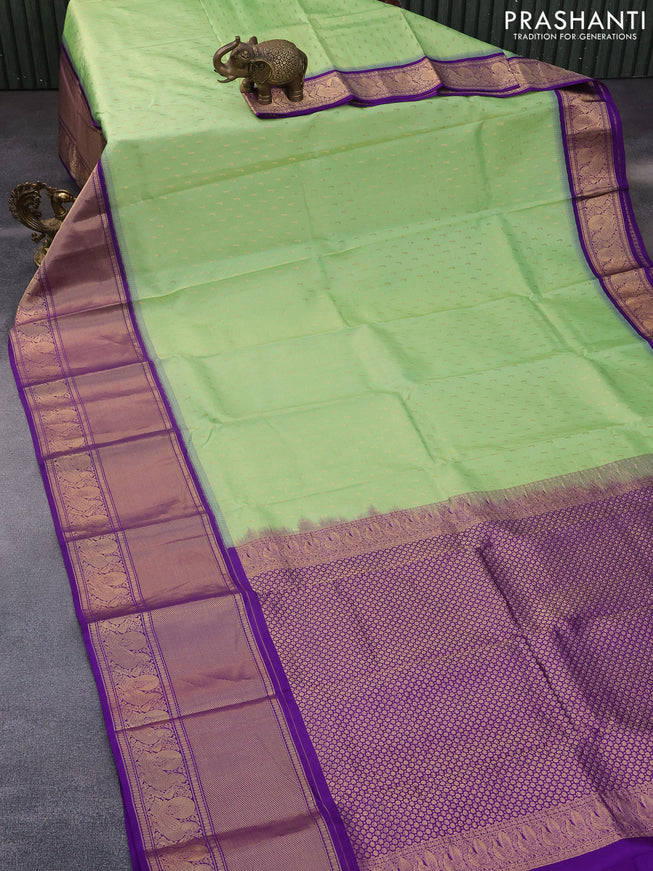 Pure soft silk saree pista green and violet with allover zari woven buttas and long annam zari woven border