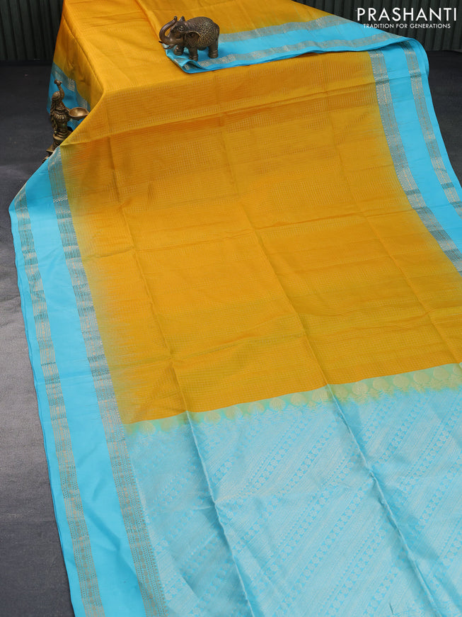 Pure soft silk saree mustard yellow and light blue with allover small zari checked pattern and rettapet zari woven border