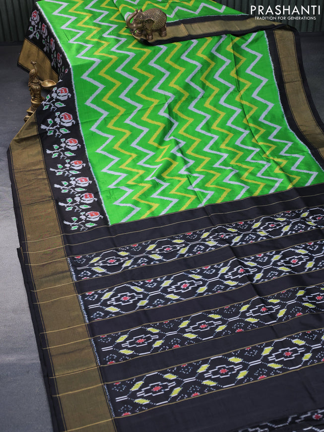 Pochampally silk saree green and black with allover zig zag ikat weaves and long ikat woven zari border