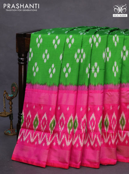 Pochampally silk saree parrot green and pink with allover ikat butta weaves and long zari woven ikat border