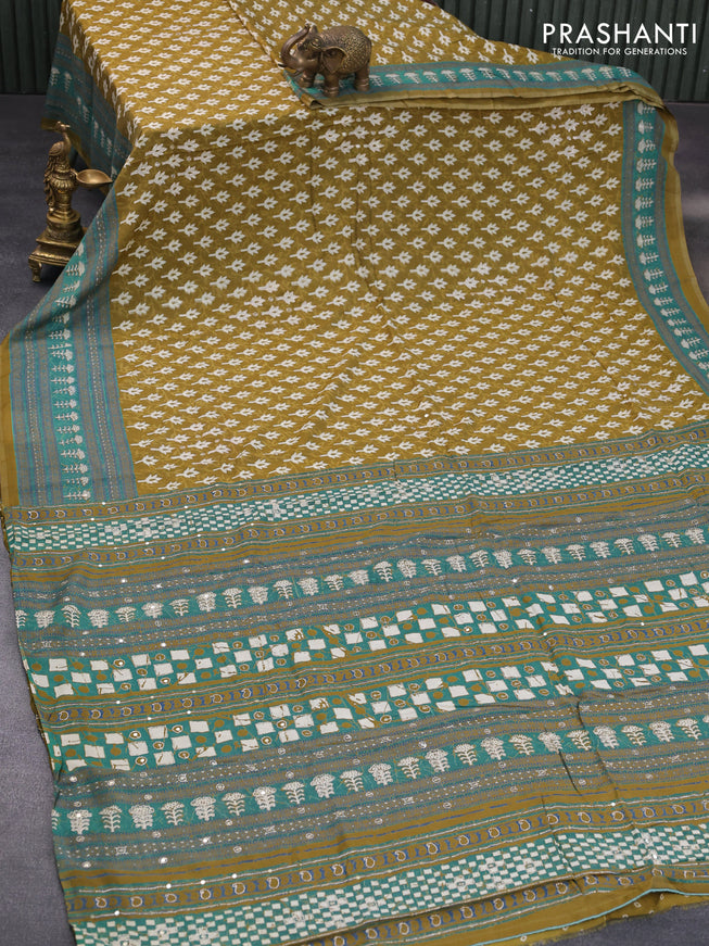 Muslin silk saree mehendi green and green with allover dabu prints & pita work and ajrakh printed border