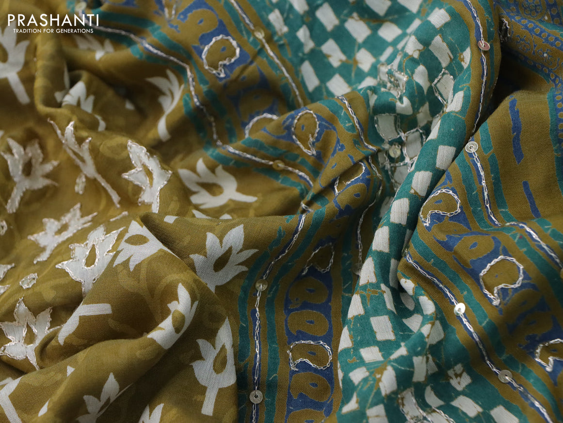 Muslin silk saree mehendi green and green with allover dabu prints & pita work and ajrakh printed border