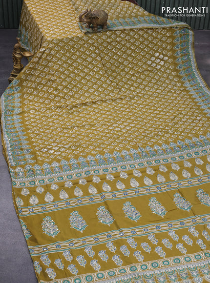 Muslin silk saree mehendi green and teal green with allover dabu prints & pita work and ajrakh printed border