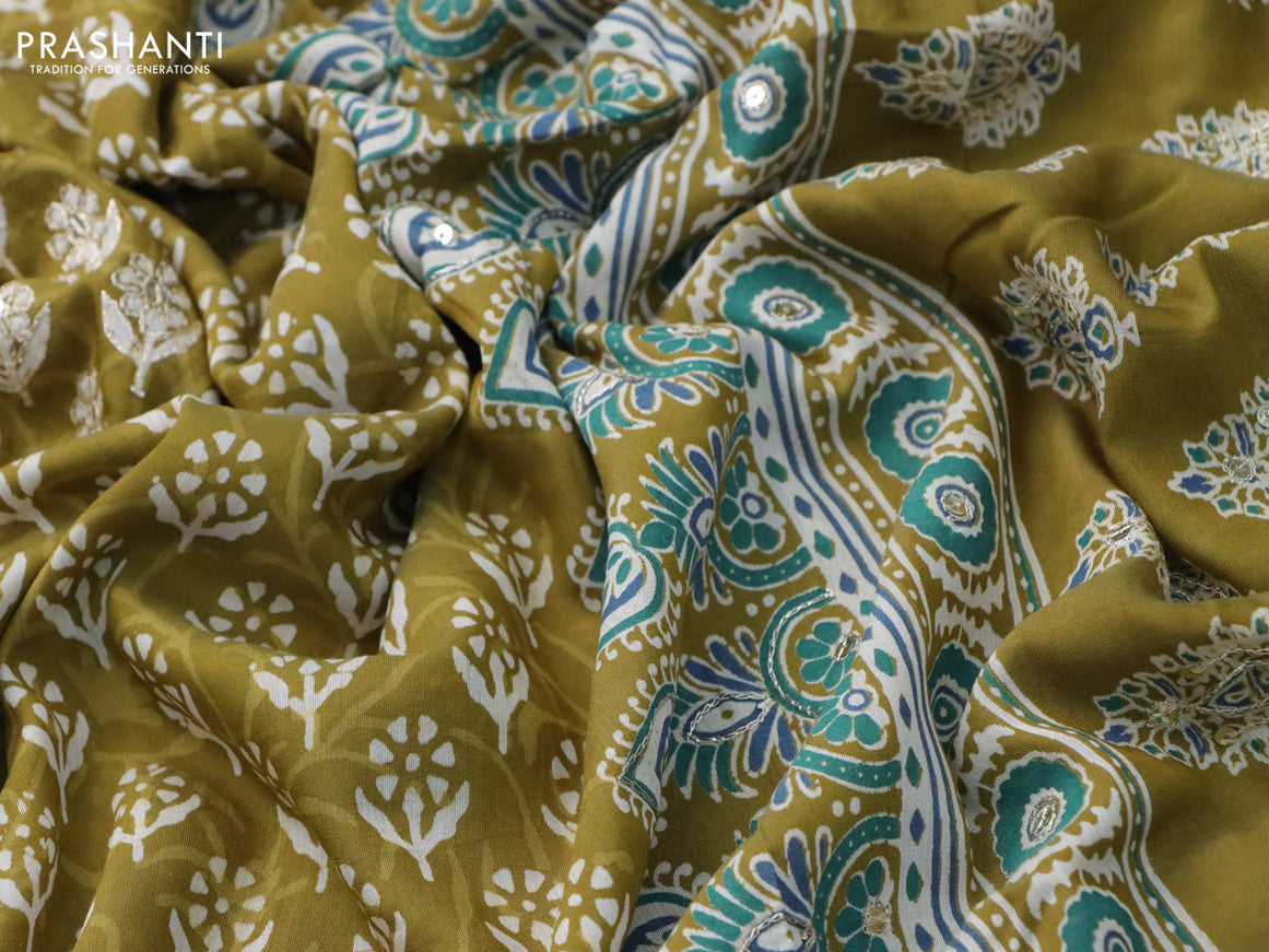 Muslin silk saree mehendi green and teal green with allover dabu prints & pita work and ajrakh printed border