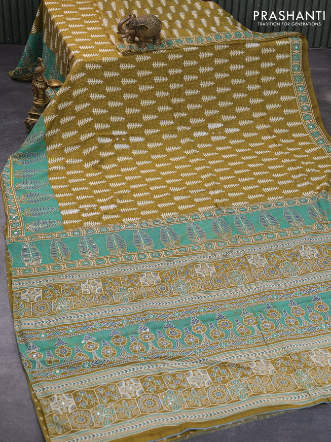 Muslin silk saree mehendi green and green with allover dabu prints & pita work and ajrakh printed border