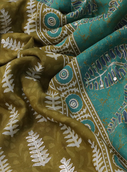 Muslin silk saree mehendi green and green with allover dabu prints & pita work and ajrakh printed border