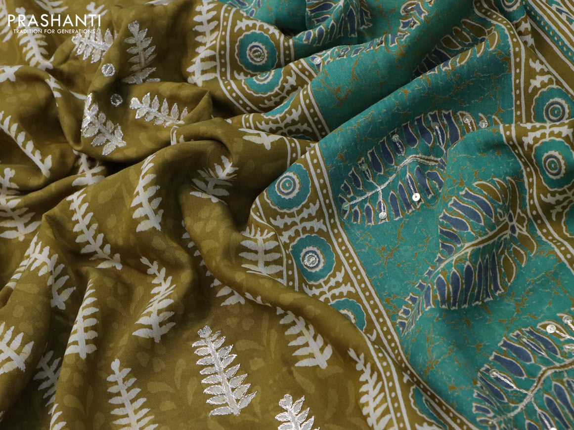 Muslin silk saree mehendi green and green with allover dabu prints & pita work and ajrakh printed border