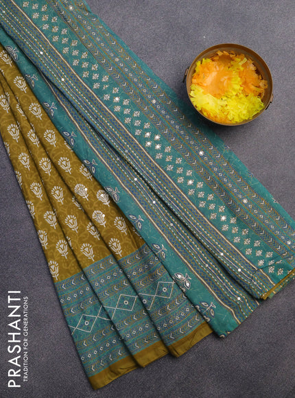 Muslin silk saree mehendi green and teal green with allover dabu prints & pita work and ajrakh printed border