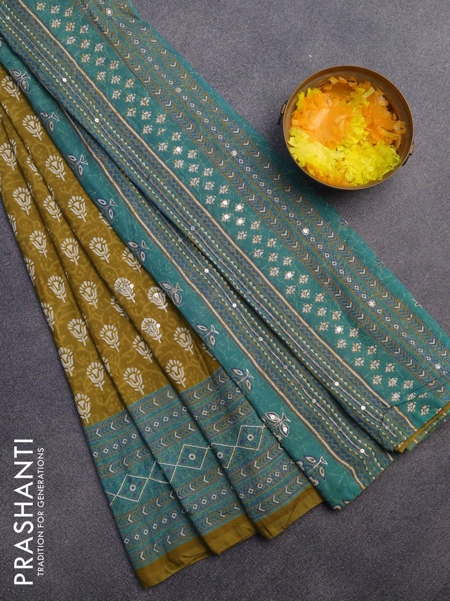 Muslin silk saree mehendi green and teal green with allover dabu prints & pita work and ajrakh printed border