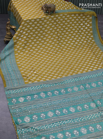 Muslin silk saree mehendi green and teal green with allover dabu prints & pita work and ajrakh printed border