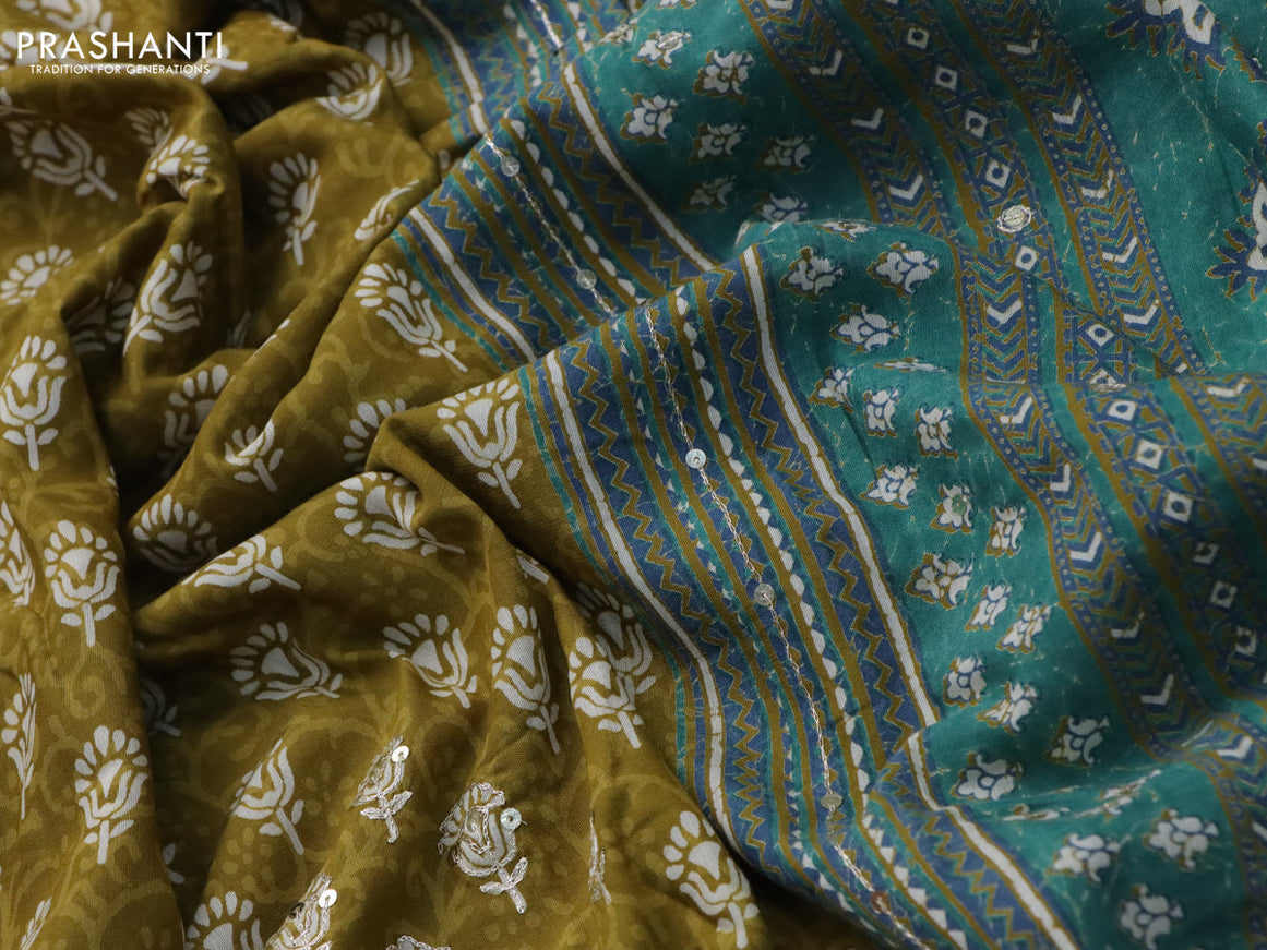 Muslin silk saree mehendi green and teal green with allover dabu prints & pita work and ajrakh printed border