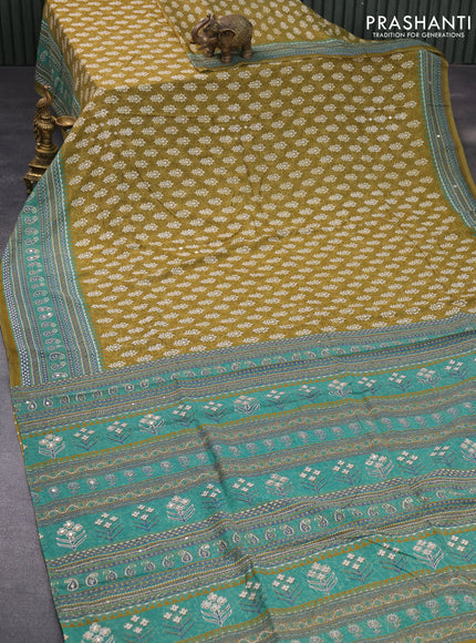 Muslin silk saree mehendi green and green with allover dabu prints & pita work and ajrakh printed border