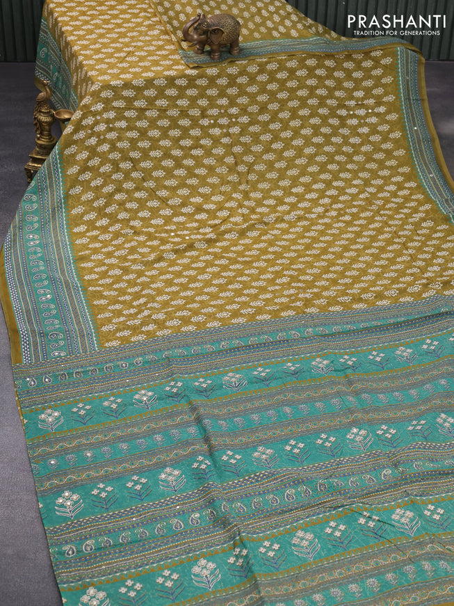 Muslin silk saree mehendi green and green with allover dabu prints & pita work and ajrakh printed border