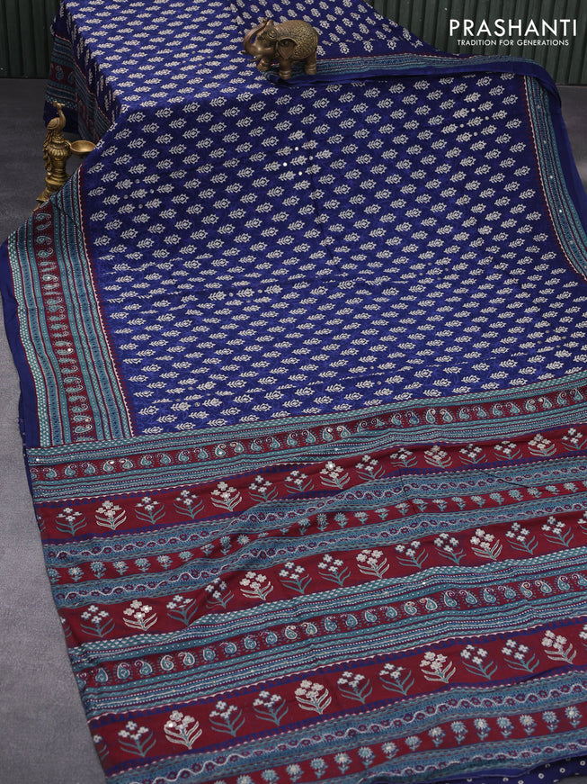 Muslin silk saree blue and green with allover dabu prints & pita work and ajrakh printed border