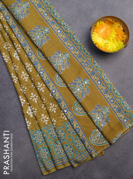 Muslin silk saree mehendi green and teal green with allover dabu prints & pita work and ajrakh printed border