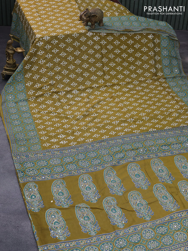 Muslin silk saree mehendi green and teal green with allover dabu prints & pita work and ajrakh printed border