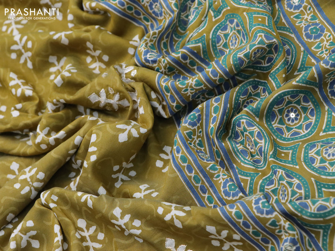 Muslin silk saree mehendi green and teal green with allover dabu prints & pita work and ajrakh printed border