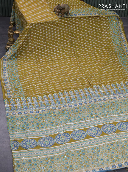 Muslin silk saree mehendi green with allover butta prints & pita work and ajrakh printed border