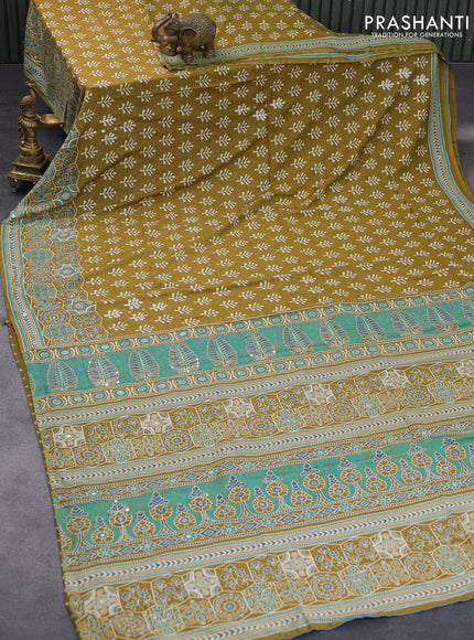 Muslin silk saree mehendi green with allover dabu prints & pita work and ajrakh printed border