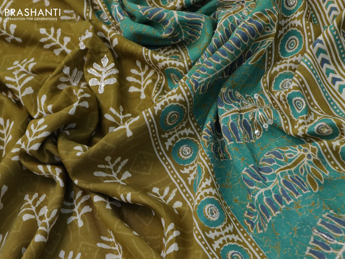 Muslin silk saree mehendi green with allover dabu prints & pita work and ajrakh printed border