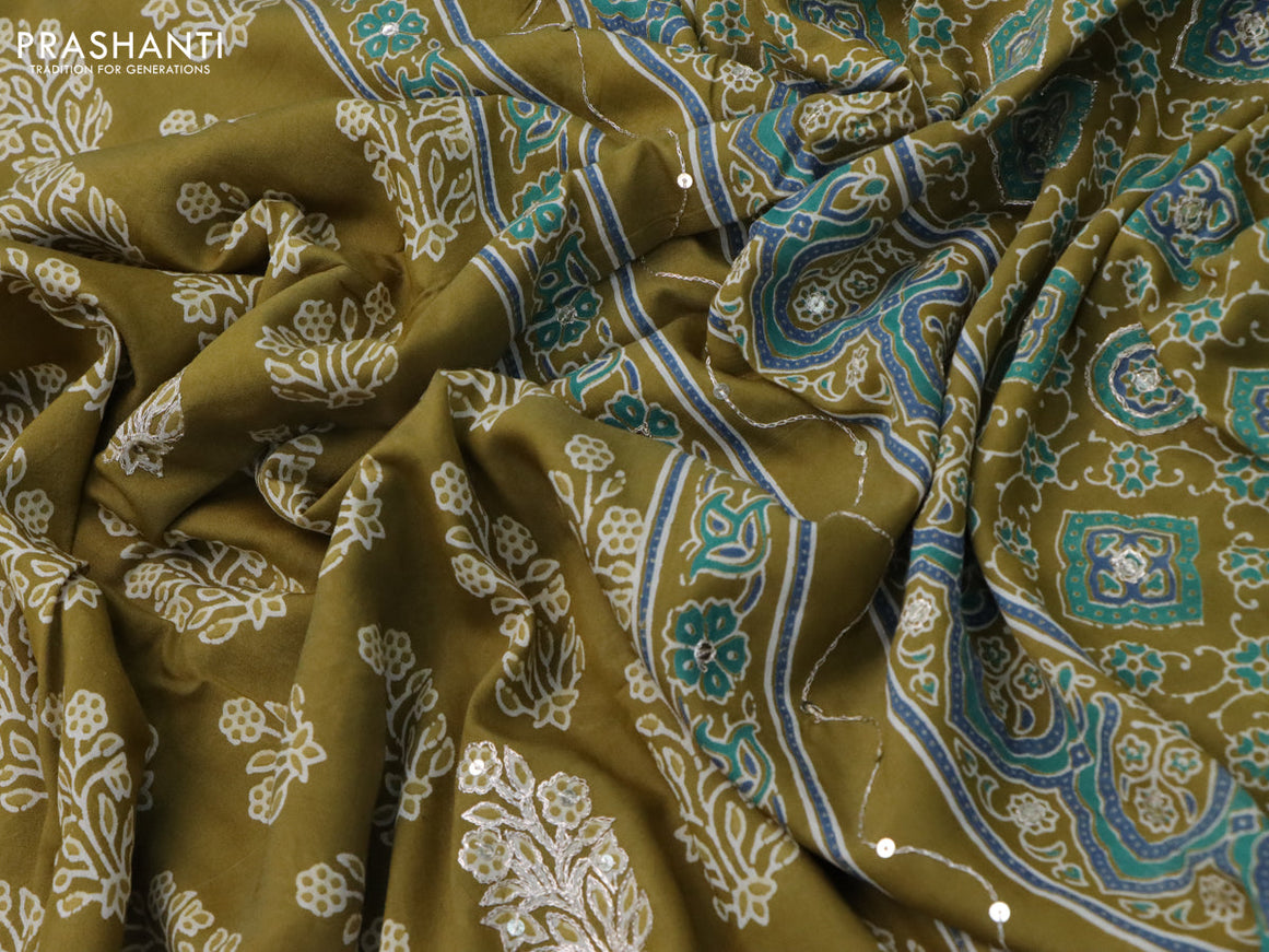 Muslin silk saree mehendi green and green with floral butta prints & pita prints and ajrakh printed border