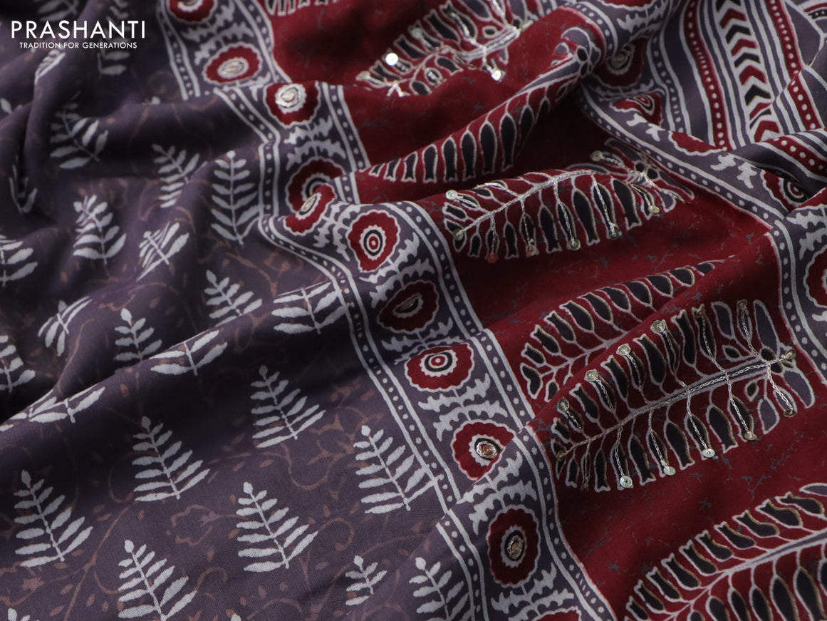 Muslin silk saree deep jamun shade and maroon with allover dabu prints & pita work and ajrakh printed border