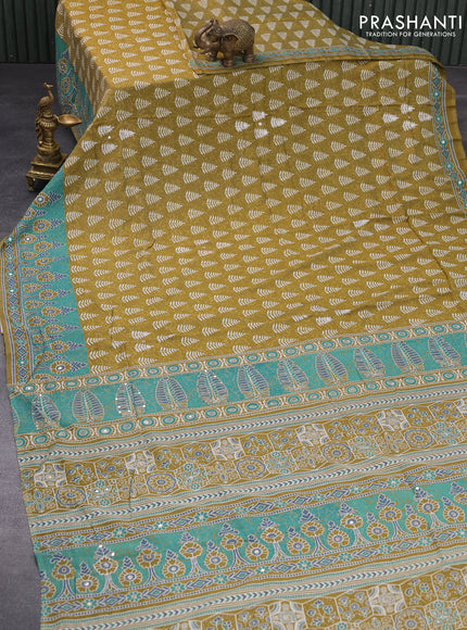 Muslin silk saree mehendi green and teal green with allover dabu prints & pita work and ajrakh printed border