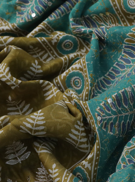 Muslin silk saree mehendi green and teal green with allover dabu prints & pita work and ajrakh printed border