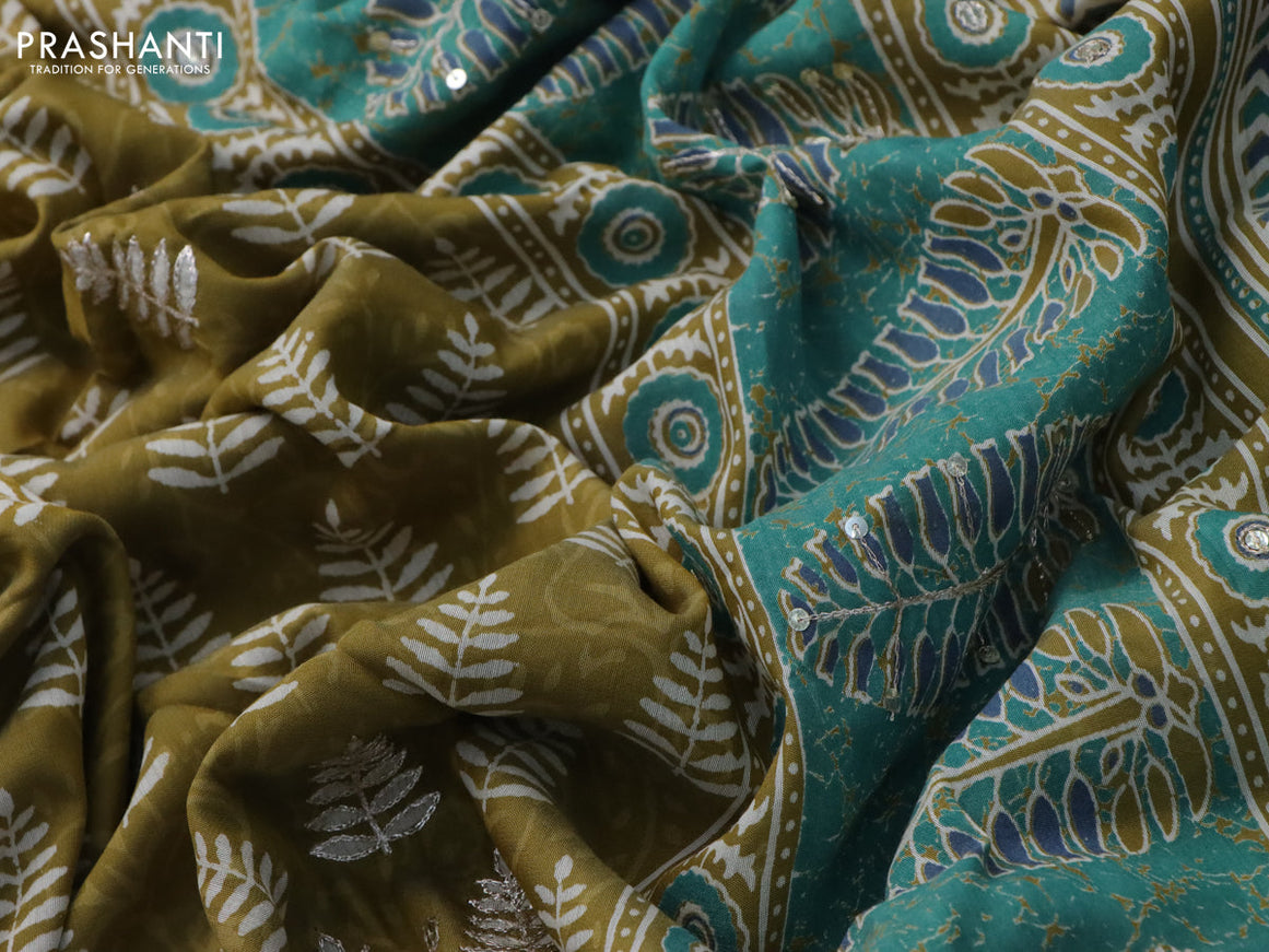 Muslin silk saree mehendi green and teal green with allover dabu prints & pita work and ajrakh printed border