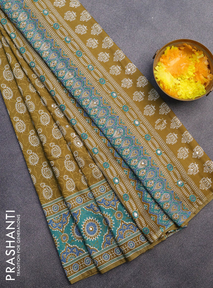 Muslin silk saree mehendi green and teal green with allover dabu prints & pita work and ajrakh printed border