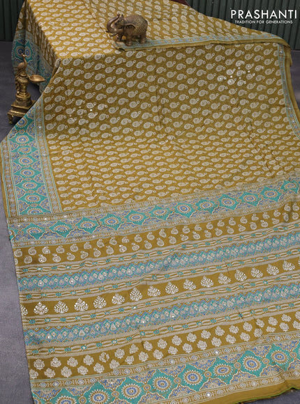 Muslin silk saree mehendi green and teal green with allover dabu prints & pita work and ajrakh printed border