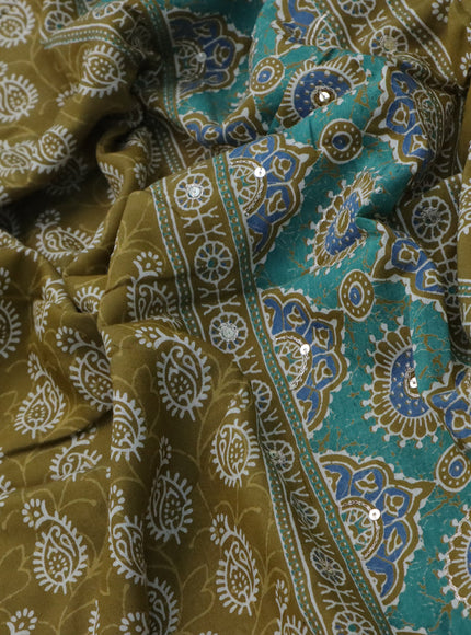 Muslin silk saree mehendi green and teal green with allover dabu prints & pita work and ajrakh printed border