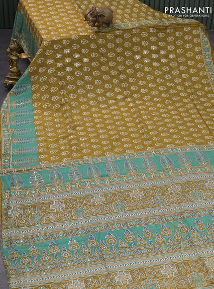 Muslin silk saree mehendi green and green with allover dabu prints & pita work and ajrakh printed border