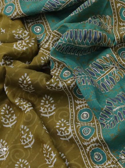 Muslin silk saree mehendi green and green with allover dabu prints & pita work and ajrakh printed border