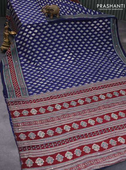 Muslin silk saree blue and maroon with allover dabu prints & pita work and ajrakh printed border