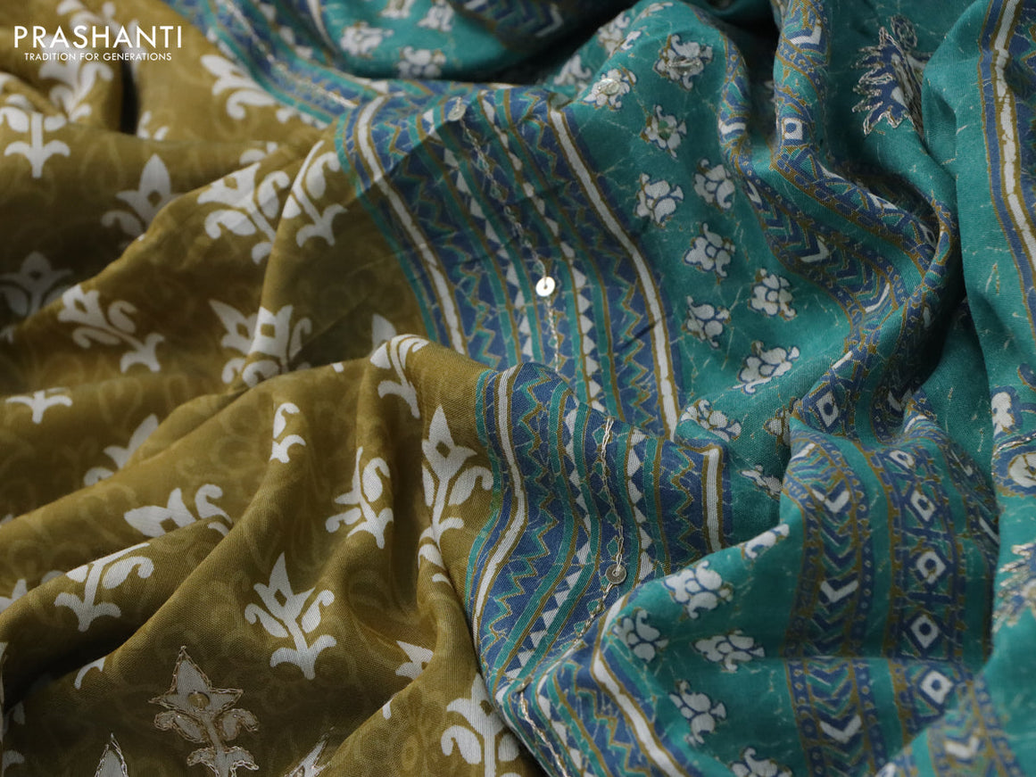 Muslin silk saree mehendi green and green with allover dabu prints & pita work and ajrakh printed border