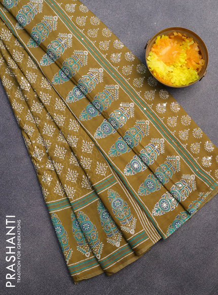 Muslin silk saree mehendi green with allover dabu prints & pita work and ajrakh printed border