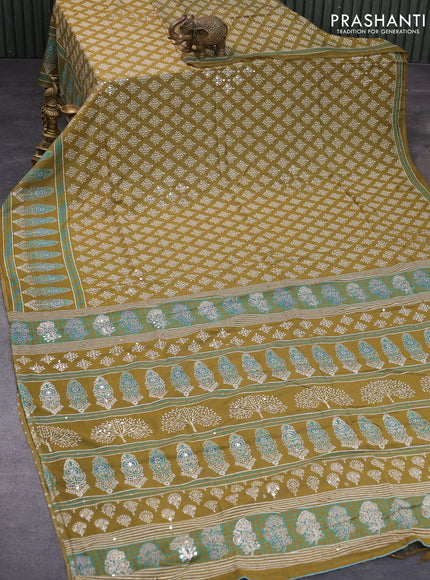 Muslin silk saree mehendi green with allover dabu prints & pita work and ajrakh printed border