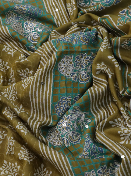 Muslin silk saree mehendi green with allover dabu prints & pita work and ajrakh printed border