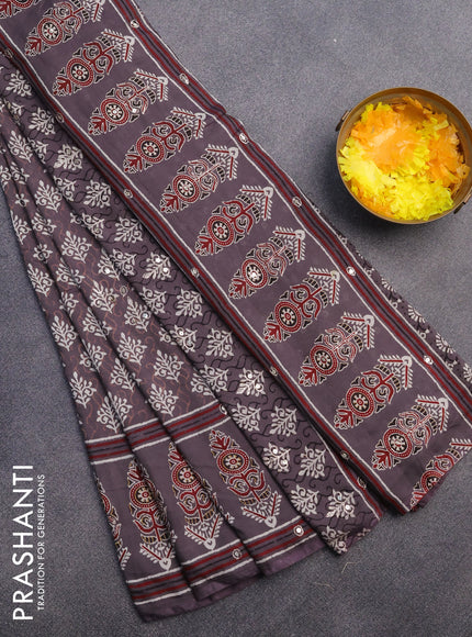 Muslin silk saree grey shade with allover dabu prints & pita work and ajrakh printed border